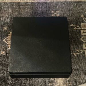 PS4 slim bought in 2021 works great just bought myself a PS five need to sell.